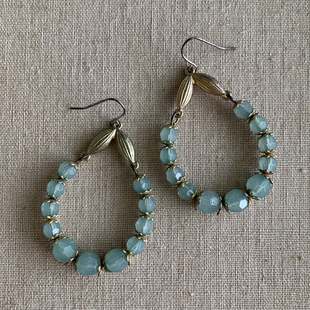 Green beaded dangle earrings